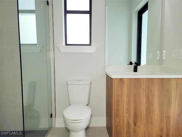 bathroom with a shower, vanity, and toilet