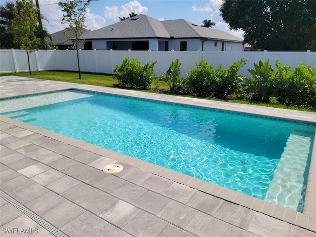 view of swimming pool with a fenced backyard, a fenced in pool, and a patio