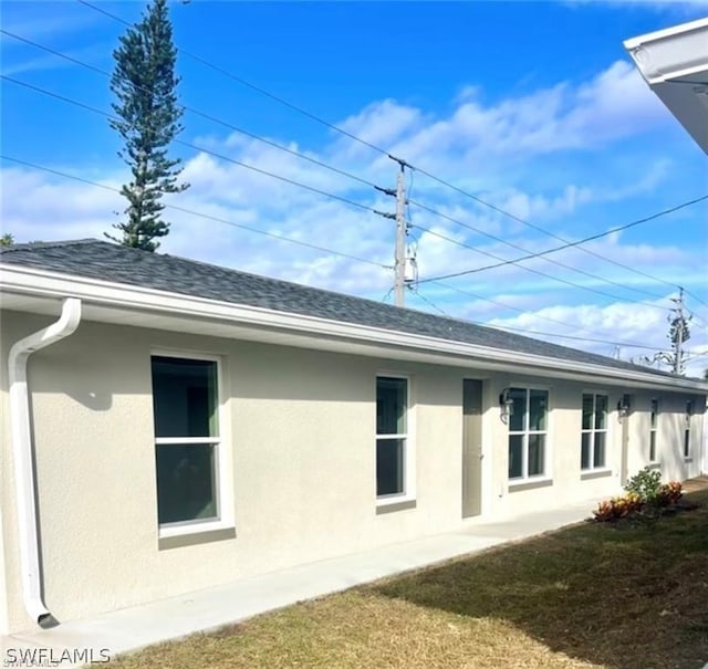 view of property exterior featuring a yard