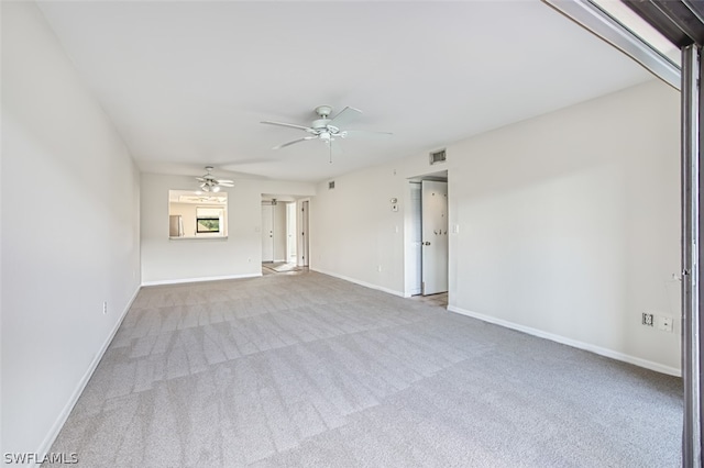 empty room with light carpet and ceiling fan