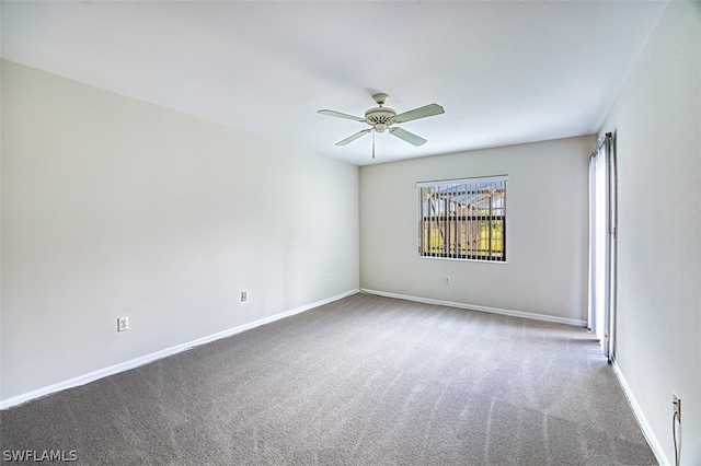 carpeted empty room with ceiling fan