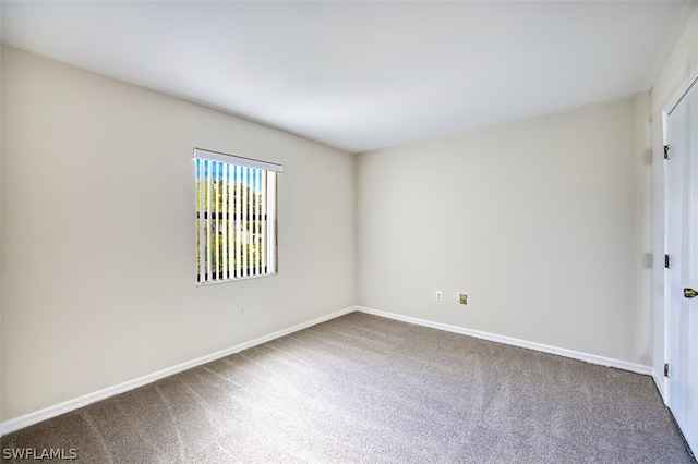 empty room with carpet flooring