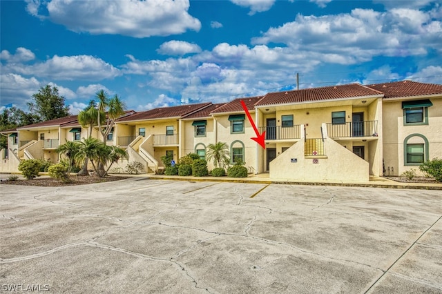 view of front of home with a balcony