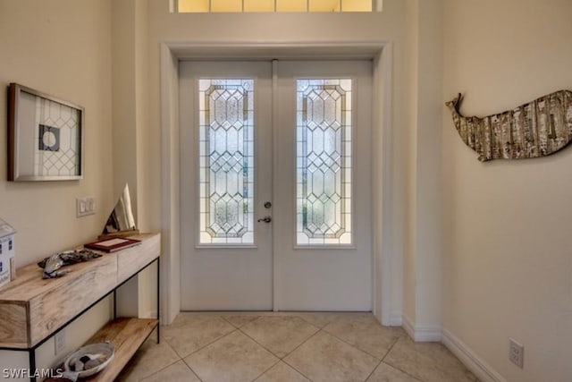 tiled entryway with french doors