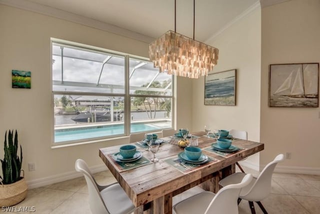 dining space featuring light tile patterned floors and ornamental molding