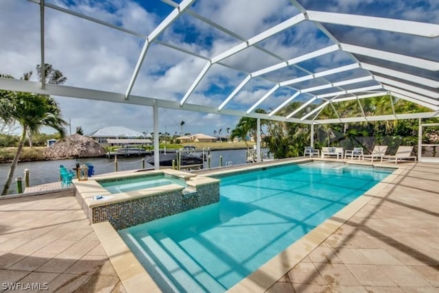 view of swimming pool featuring an in ground hot tub, a water view, a patio area, and a lanai