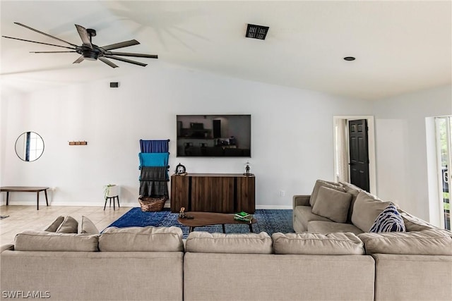 living room with ceiling fan and lofted ceiling