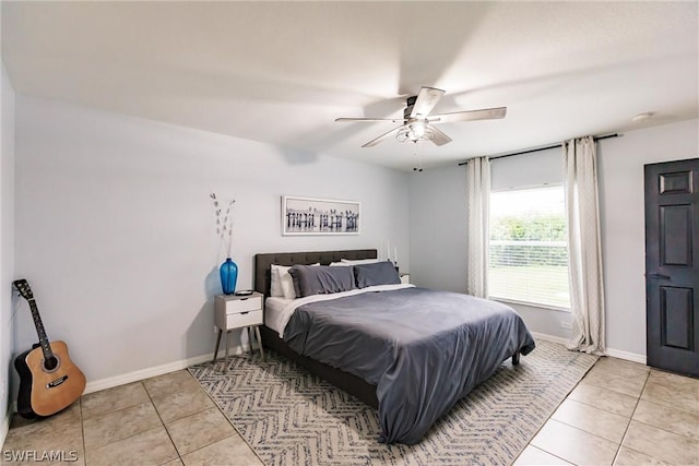 bedroom featuring ceiling fan and light tile patterned flooring