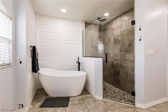 bathroom featuring tile patterned floors, plenty of natural light, and shower with separate bathtub