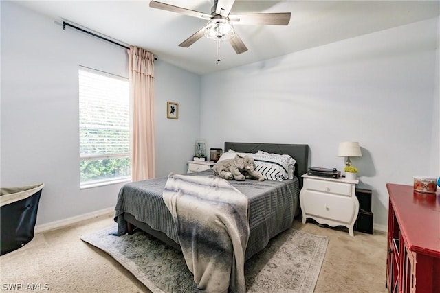 bedroom with light colored carpet and ceiling fan