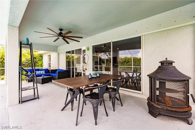 view of patio with an outdoor living space and ceiling fan