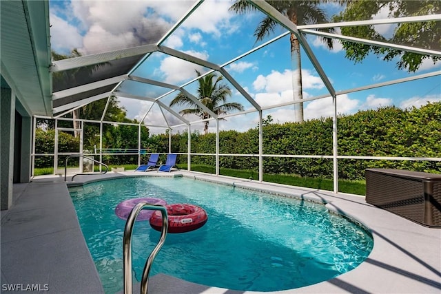 view of pool with a lanai and a patio area