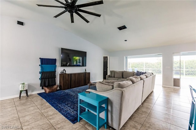 tiled living room featuring ceiling fan and vaulted ceiling