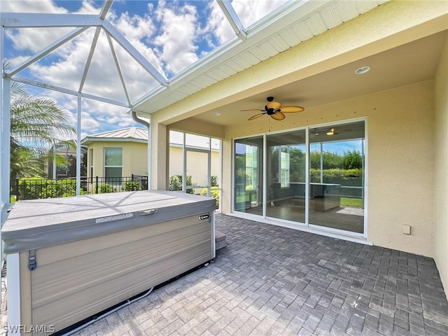 sunroom / solarium with a hot tub