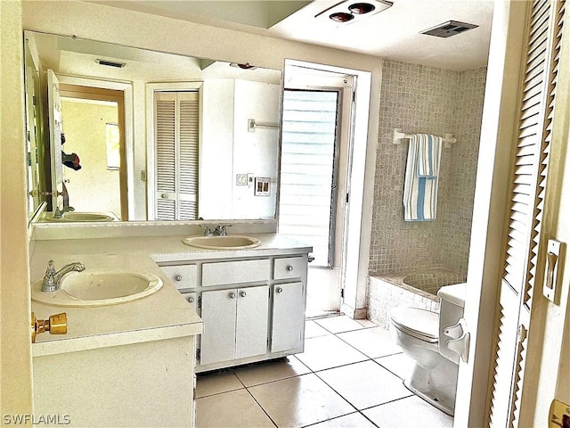 full bathroom with tile patterned flooring, vanity, toilet, and a wealth of natural light