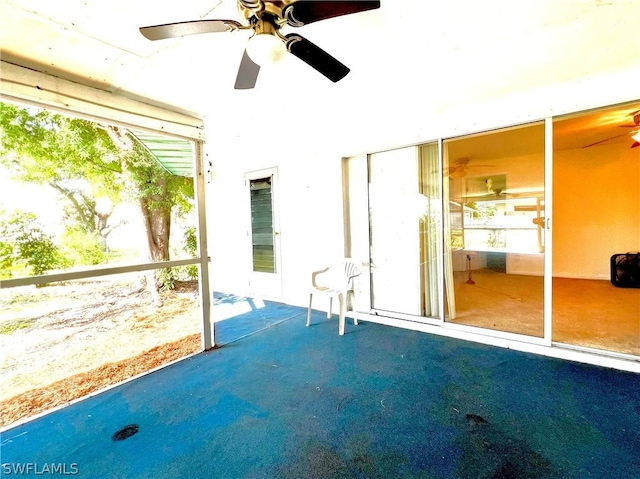 interior space featuring ceiling fan