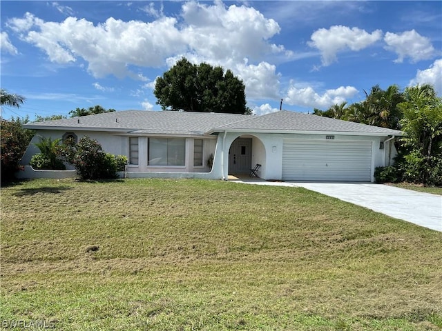 ranch-style house with a garage and a front lawn