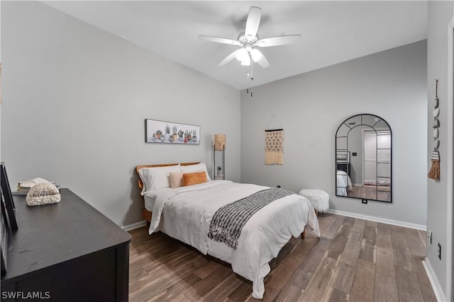 bedroom featuring dark hardwood / wood-style flooring and ceiling fan