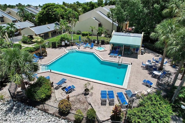 view of swimming pool featuring a patio area