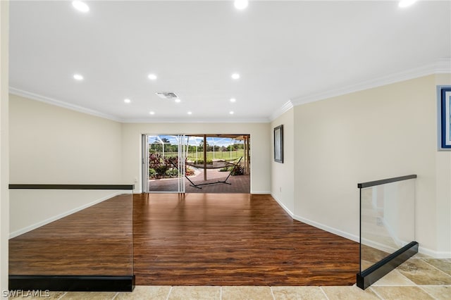 interior space with crown molding and light hardwood / wood-style flooring