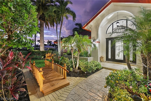 view of patio terrace at dusk