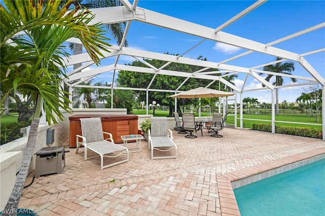 view of patio / terrace with glass enclosure and a pool with hot tub