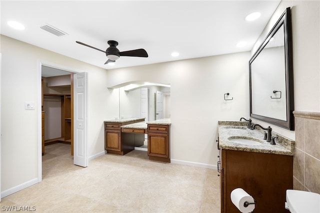 bathroom with ceiling fan and vanity