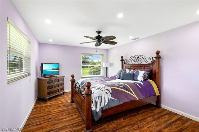 bedroom featuring ceiling fan and dark wood-type flooring