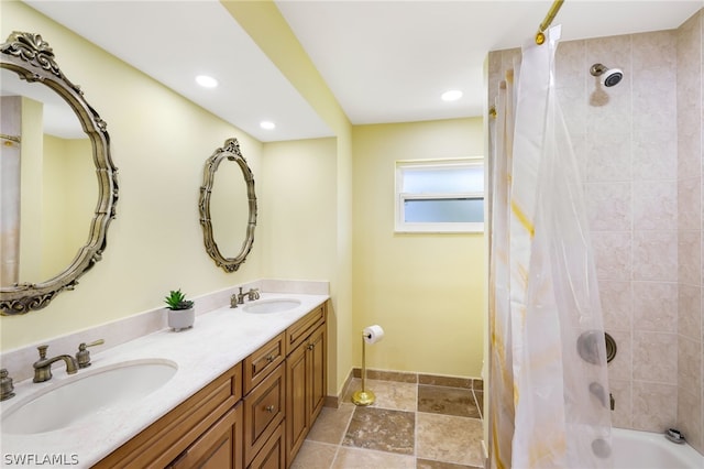 bathroom with vanity and shower / tub combo with curtain