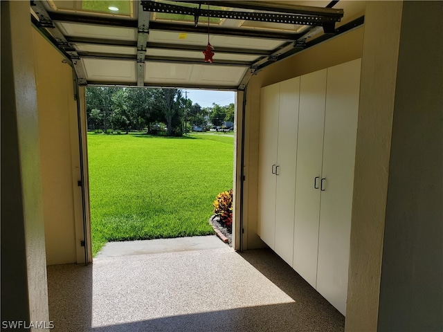 garage featuring a yard