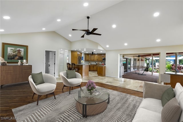 living room featuring light wood-type flooring and high vaulted ceiling