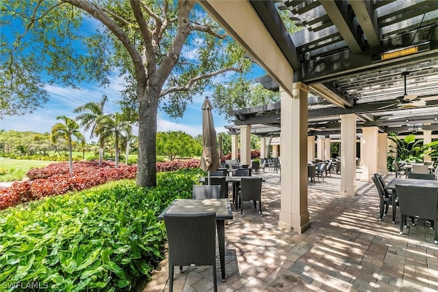 view of patio featuring ceiling fan and a pergola