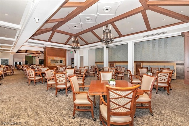 dining room with coffered ceiling, ornamental molding, beamed ceiling, and an inviting chandelier