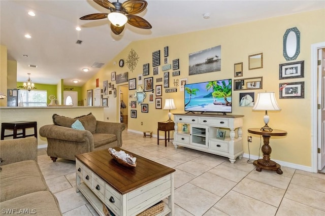 living room featuring light tile patterned floors, ceiling fan with notable chandelier, and vaulted ceiling