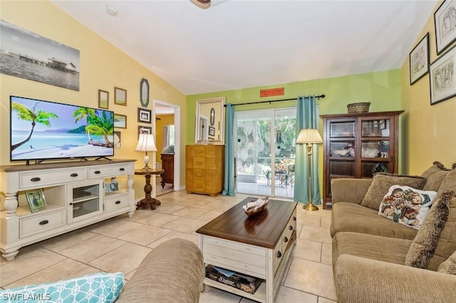 living room featuring light tile patterned floors and vaulted ceiling