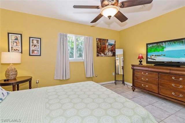 tiled bedroom with ceiling fan