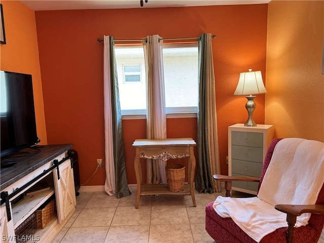 sitting room featuring light tile patterned flooring