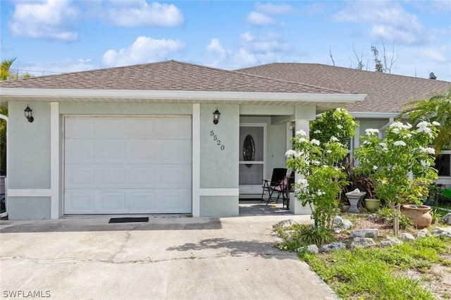 ranch-style home featuring a garage