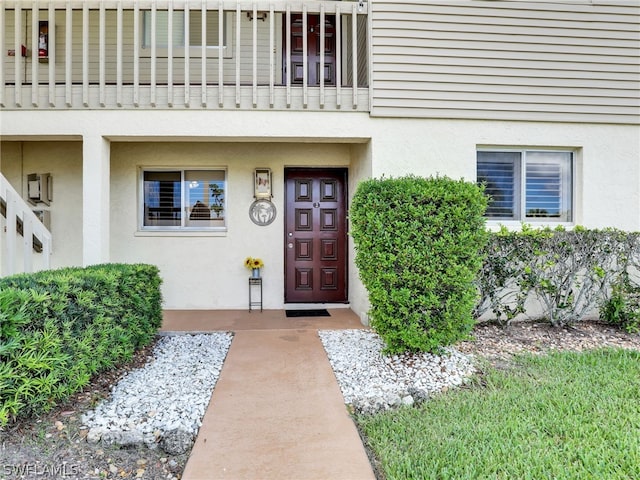 property entrance with a balcony