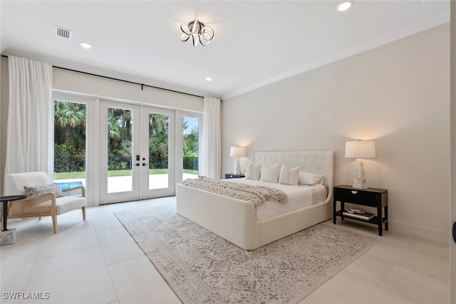 tiled bedroom featuring multiple windows, access to outside, and french doors