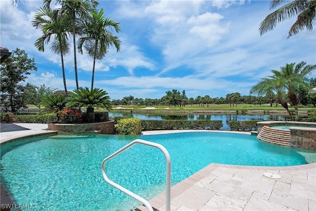 view of pool featuring an in ground hot tub and a water view