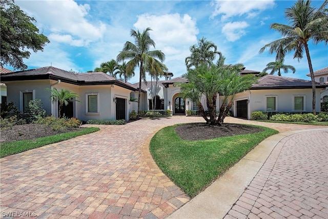 mediterranean / spanish-style home featuring a garage