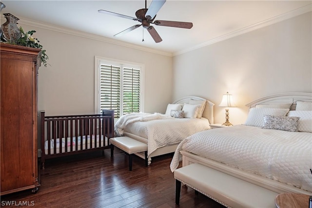 bedroom with ceiling fan, crown molding, and dark hardwood / wood-style floors