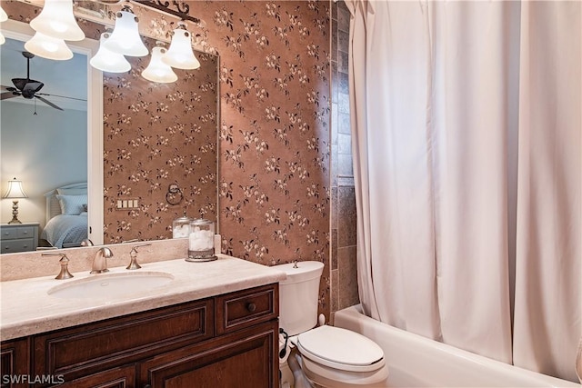 full bathroom with shower / bath combo, vanity, toilet, and ceiling fan