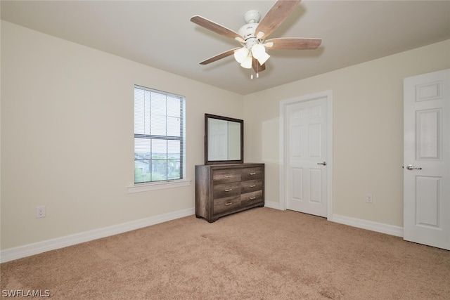 bedroom with light carpet and ceiling fan