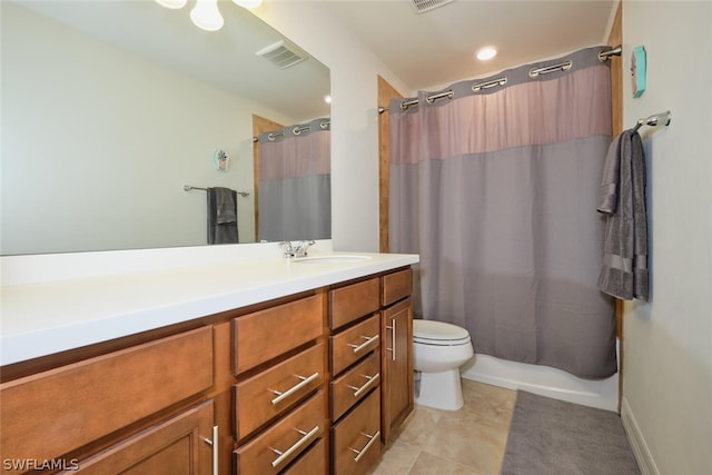 full bathroom with tile patterned flooring, shower / bath combination with curtain, vanity, and toilet