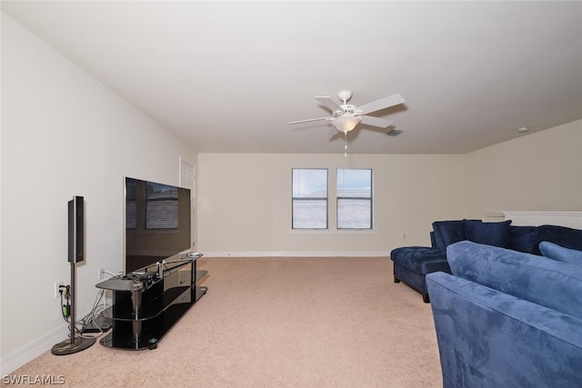 carpeted living room with ceiling fan