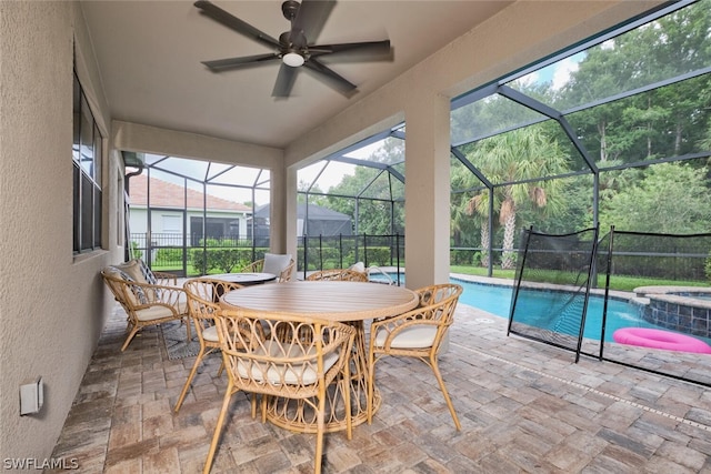 sunroom / solarium featuring ceiling fan and a pool