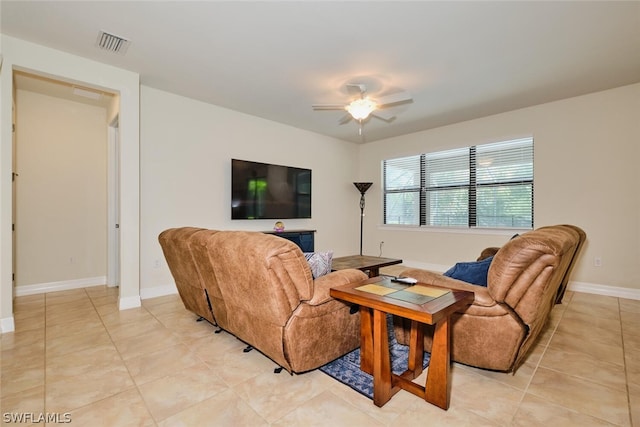 living room featuring ceiling fan and light tile patterned floors