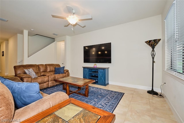 living room featuring ceiling fan and light tile patterned flooring